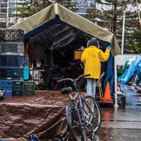 Volunteer visiting a homeless encampment